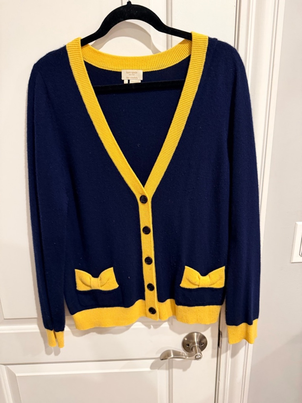 kate spade navy cardigan with yellow trim and bow pockets